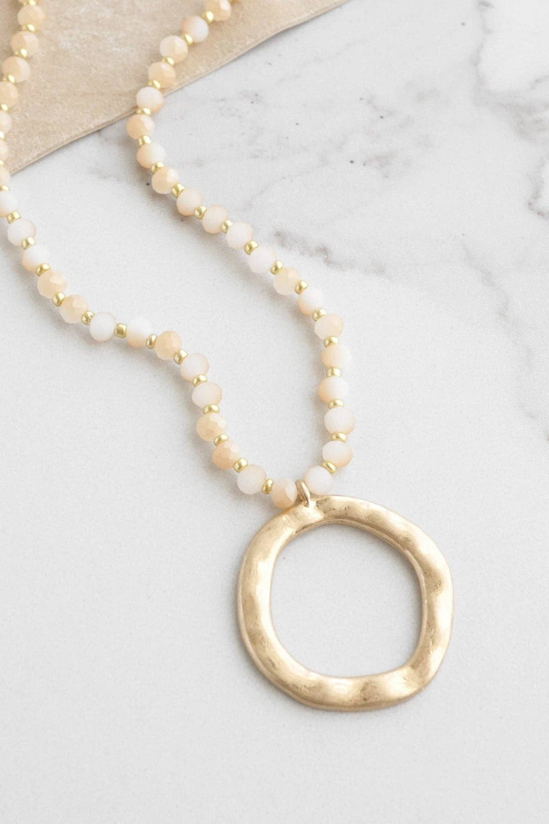 Beaded Necklace with Gold Tone Circle Pendant Light Brown