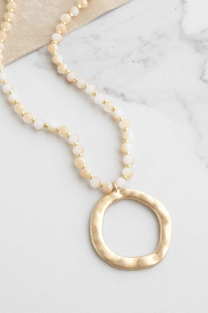 Beaded Necklace with Gold Tone Circle Pendant Light Brown